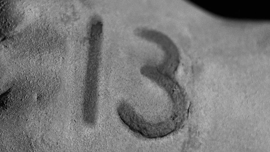 A burn in the form of the number "13" on the hand of one of the characters in the film