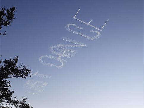 Skywriting is the inscription in the sky, which makes a small aircraft with the use of smoke.

In the sky over Manhattan there was a huge inscription "Lost Our Lease", "Last chance" and "Now open".
Translated by «Yandex.Translator»